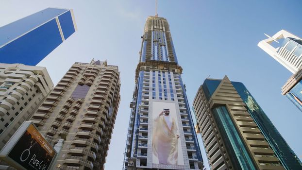 Tall and modern skyscrapers of Dubai on a sunny day