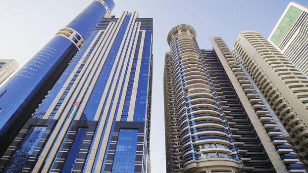 Tall and modern skyscrapers of Dubai on a sunny day