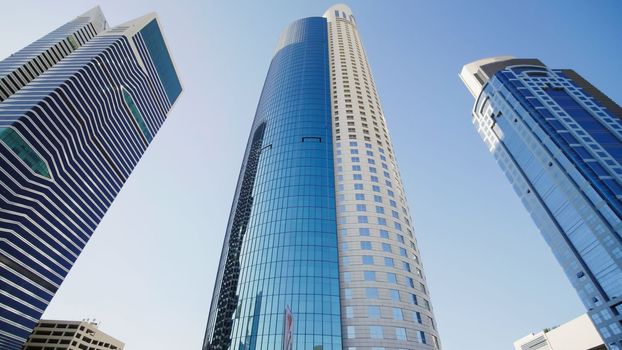 Tall and modern skyscrapers of Dubai on a sunny day