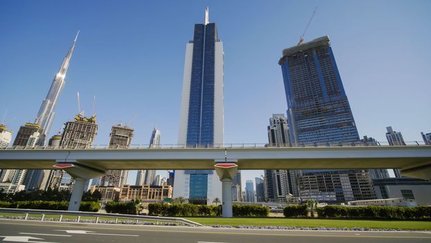 Tall and modern skyscrapers of Dubai on a sunny day