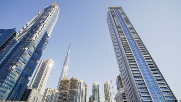 Tall and modern skyscrapers of Dubai on a sunny day