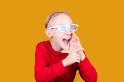 a child in 3D glasses puts his hand to his mouth and screams