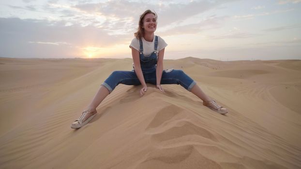 Happy girl in the desert of the arab emirates