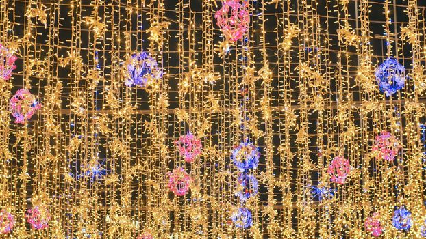 Hanging illumination on the streets of city