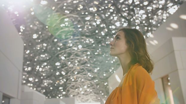 Girl enjoys views of the Louvre Hall in Abu Dhabi