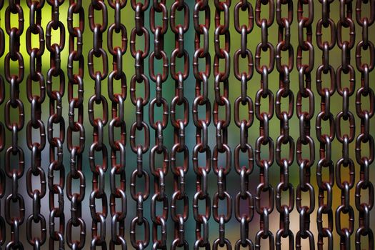 Background of metal chains, old used chain. Metal curtain on the entrance of bird park. The door made of chain link to prevent the bird fly away from the bird cage.