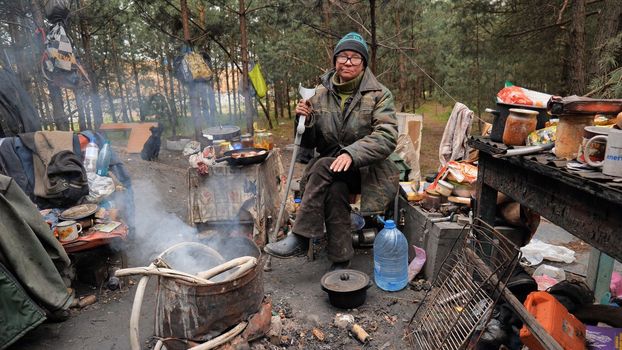 Beggars huts of homeless people near the landfill
