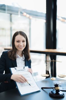 The lawyer with a client discussing contract paper, a Business lawyer working about legal legislation in the courtroom to help their customer, contract and agreement concept