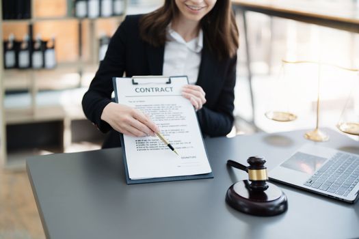 The lawyer with a client discussing contract paper, a Business lawyer working about legal legislation in the courtroom to help their customer, contract and agreement concept
