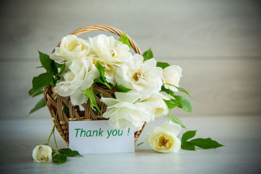 bouquet of beautiful white roses on a wooden table