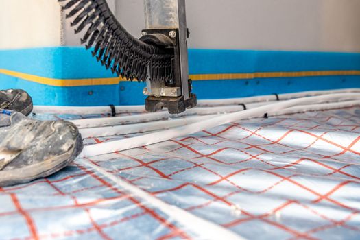 stapler for underfloor heating pipes.