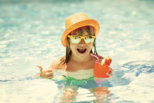 Summer kids cocktail. Happy little boy in swimming pool. Children summer vacation