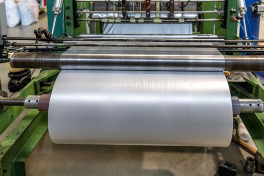 plastic roll on the machine for the production of plastic bags.