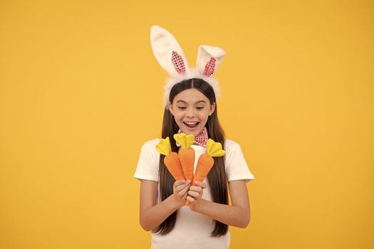 Easter time. just having fun. ready for party. happy childhood. cheerful bunny kid with carrot. happy easter holiday. funny child in rabbit ears. smiling teenager girl in bow tie. bunny hunt begin.