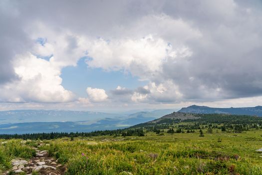 Forests and mountains of the Southern Urals near the village of Tyulyuk in Russia. Drone view