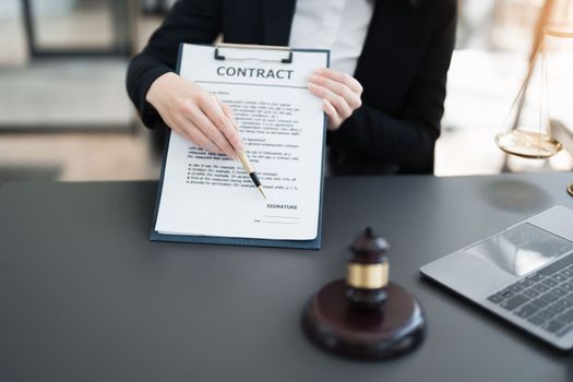 The lawyer with a client discussing contract paper, a Business lawyer working about legal legislation in the courtroom to help their customer, contract and agreement concept