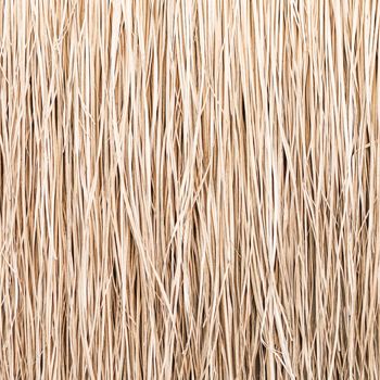 Close up of thatch roof or wall background. Tropical roofing on beach. High quality photo