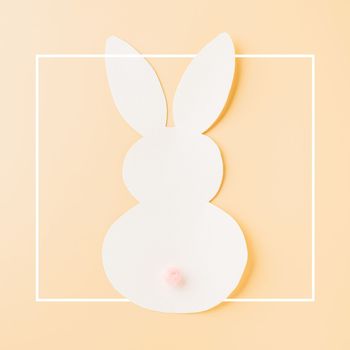 Easter Day Concept. Above overhead handmade white paper rabbit cutting isolated on pastel background with copy space for your text, Happy Easter Bunny holiday, Banner design for web