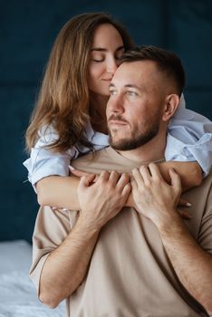 earlier morning bride and groom at home in bed