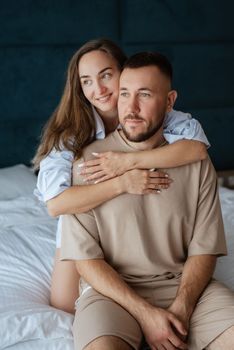 earlier morning bride and groom at home in bed