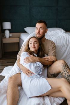 earlier morning bride and groom at home in bed