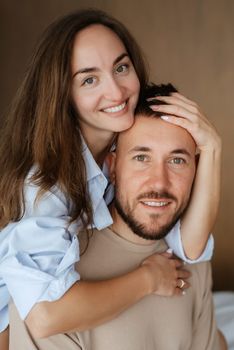 earlier morning bride and groom at home in bed