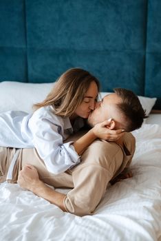 earlier morning bride and groom at home in bed