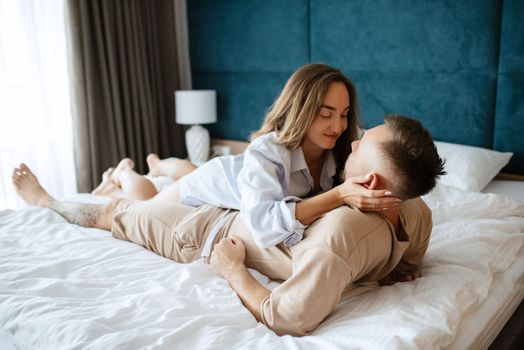 earlier morning bride and groom at home in bed