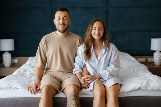 earlier morning bride and groom at home in bed