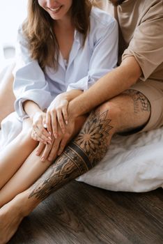 earlier morning bride and groom at home in bed