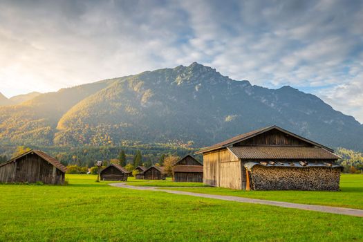 Bavarian alps and rustic farm barns, Garmisch Partenkirchen, Zugspitze massif, Bavaria, Germany