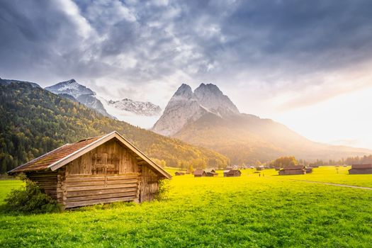 Bavarian alps and rustic farm barns, Garmisch Partenkirchen, Zugspitze massif, Bavaria, Germany