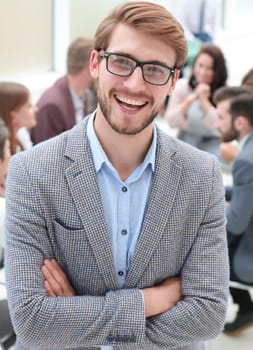 close up. smiling business man on the background of the office . business people