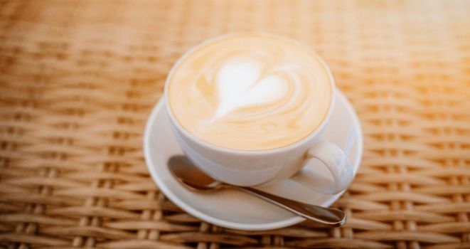 cup cappuccino baner table. Coffee with espresso and milk in a cafe.