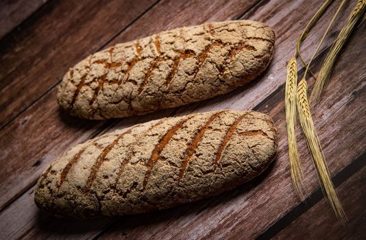 Rye bread on brown background. High quality photo