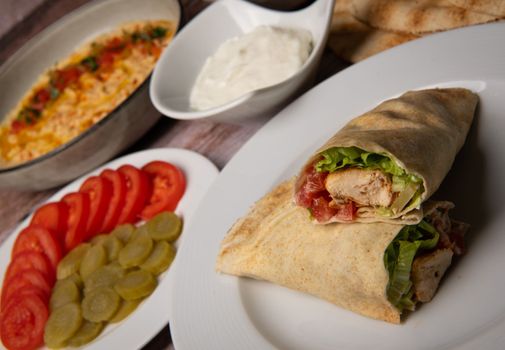 Lebanese recipe of chich taouk, garlic cream, toum, in a Lebanese bread, tabbouleh and chickpea puree, hummus High quality photo