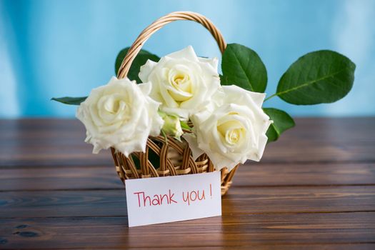 bouquet of beautiful white roses on a wooden table