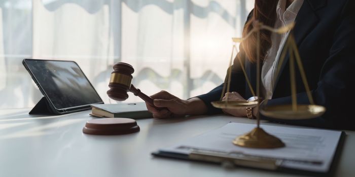 Close up of business lawyers working with agreement contract in office. Law, legal services, advice, Justice concept.