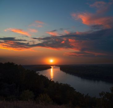 Aerial view of sunset river. Drone flying over the river at dawn with beautiful sky