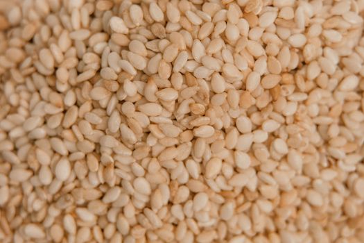 sesame seeds. Pile of white sesame seeds as background, top view.