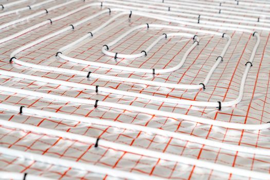 underfloor heating in the room on the construction site.