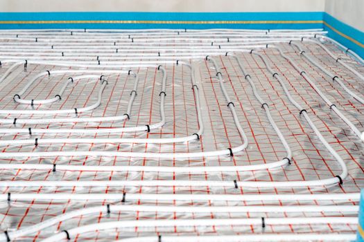 underfloor heating in the room on the construction site.