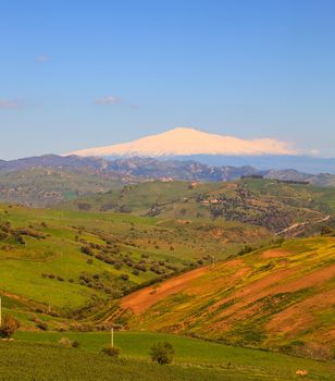 View of Etna volcano and Sicily field