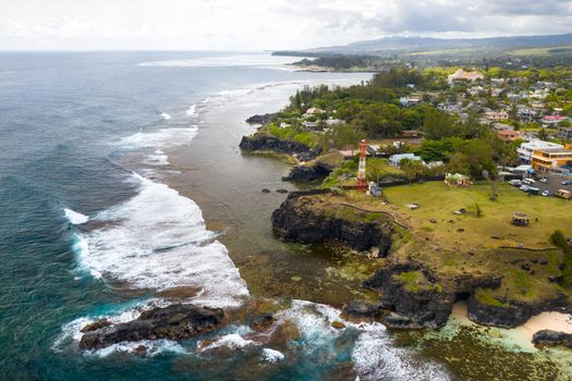 View of the famous Golden beach between black volcanic rocks on the banks of the Gris-Gris river,La Roche qui pleure in Mauritius.