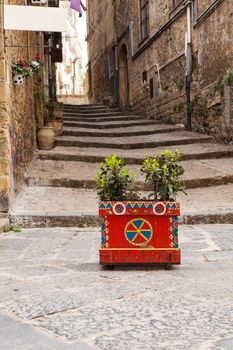 Decorated pot in the alley of Piazza Armerina, Sicily. Italy