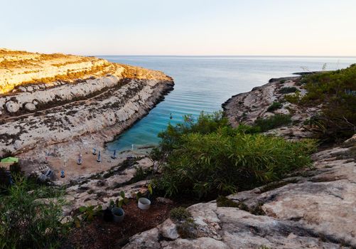 LAMPEDUSA, ITALY - JULY, 29: View of Cala Greca at sunset in the summer season on July 29, 2018