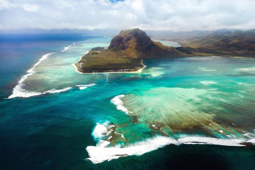 A bird's-eye view of Le Morne Brabant, a UNESCO world heritage site.Coral reef of the island of Mauritius.Storm cloud.