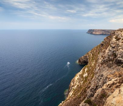 View of the scenic cliff coast of Lampedusa, Sicily