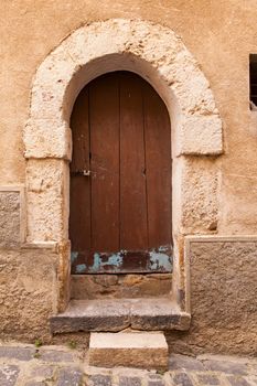 Old wooden door in Piazza Armerina, Sicily. Italy