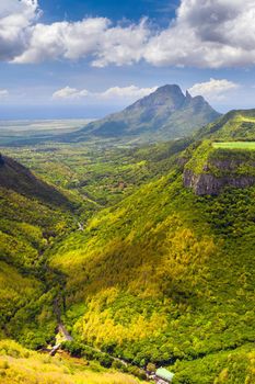 Mountain Landscape of the gorge on the island of Mauritius, Green mountains of the jungle of Mauritius.